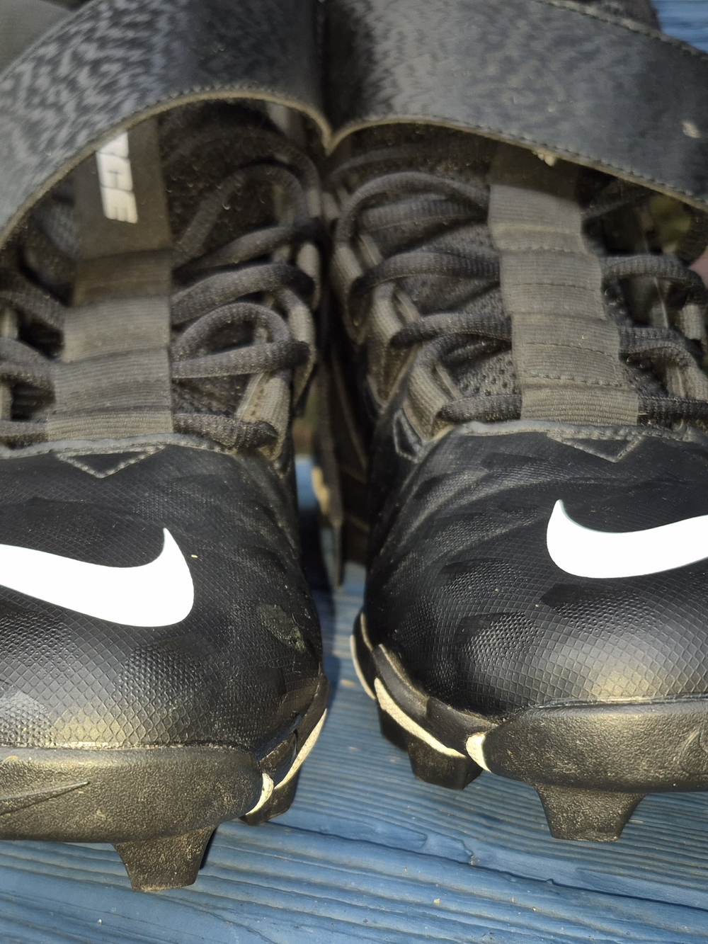 Nike Black Football Cleats with White Swoosh